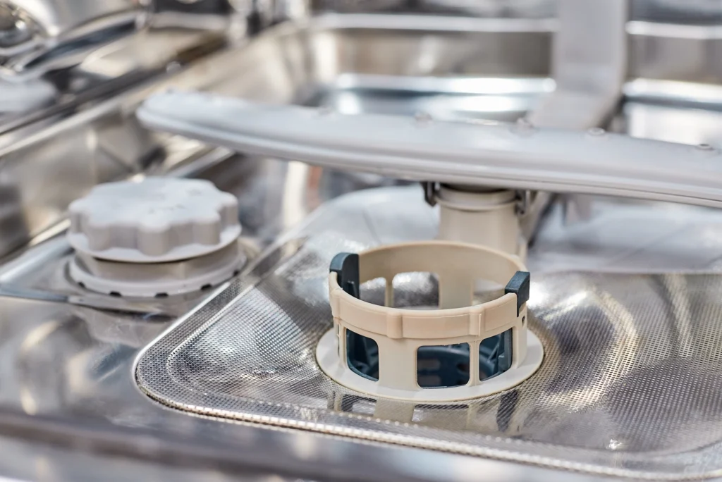 the base of the dishwasher showing the filter in the centre