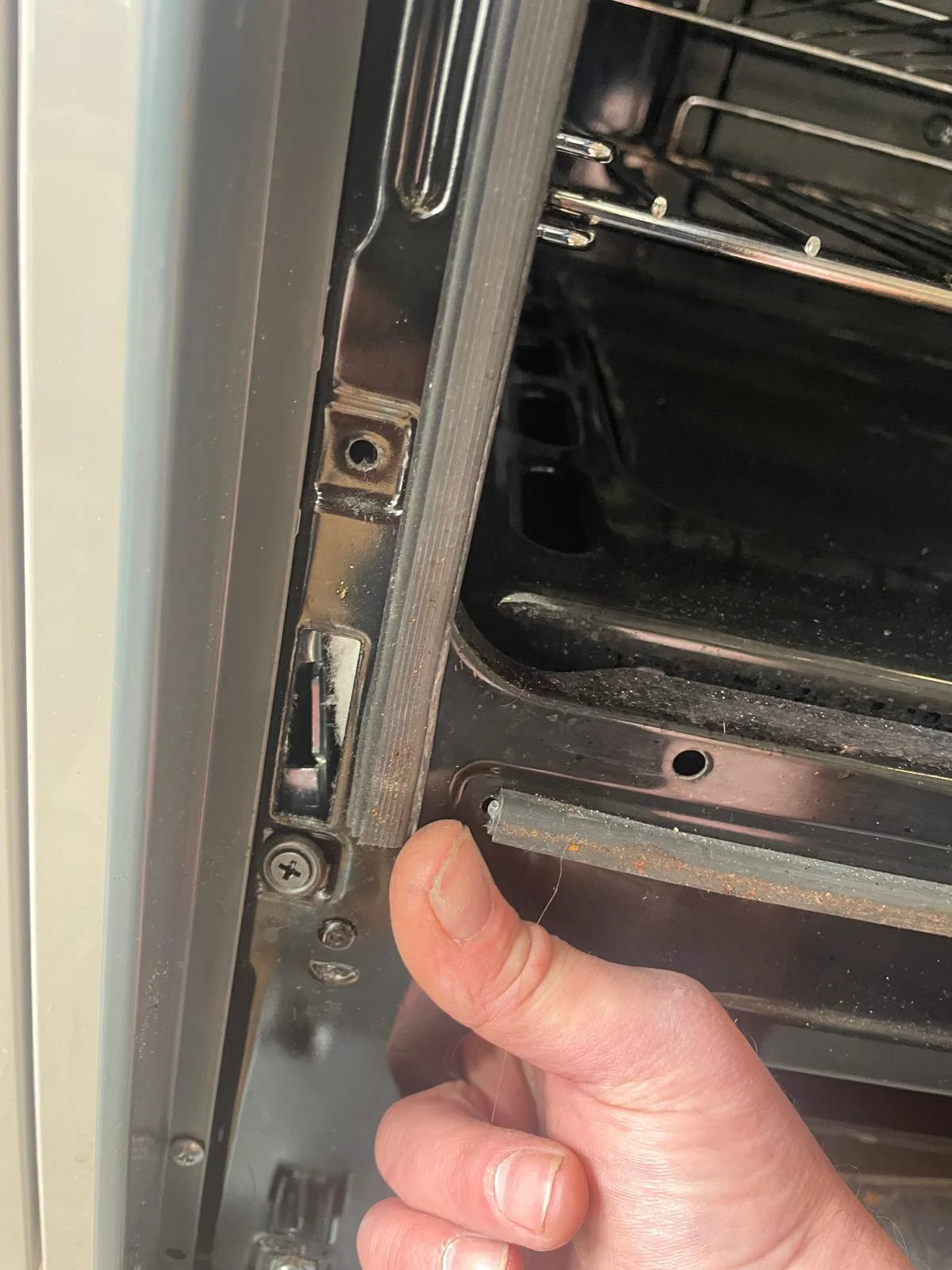 Our engineer repairing the door of a Fisher and Paykel oven for a Bristol customer