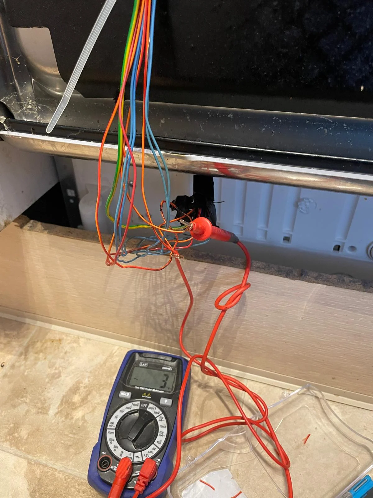 A professional Hotpoint dishwasher wiring repair carried out by an engineer in Saltford, showing the internal circuitry and moisture protection.