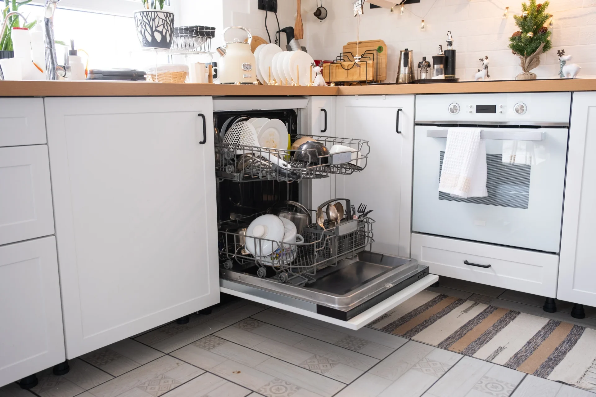 Local engineer performing a professional dishwasher repair in a Bristol kitchen.
