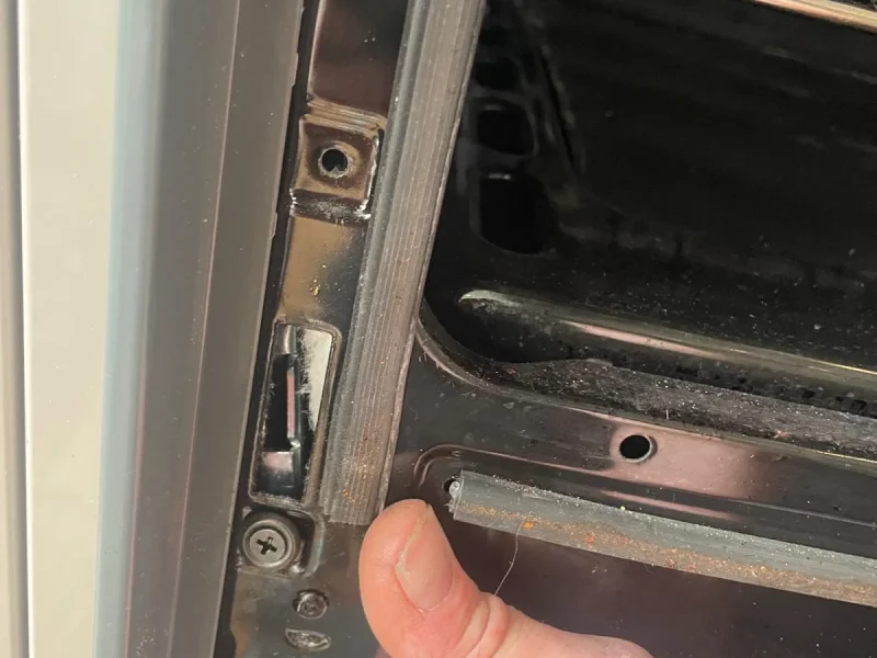 Our engineer repairing the door of a Fisher and Paykel oven for a Bristol customer