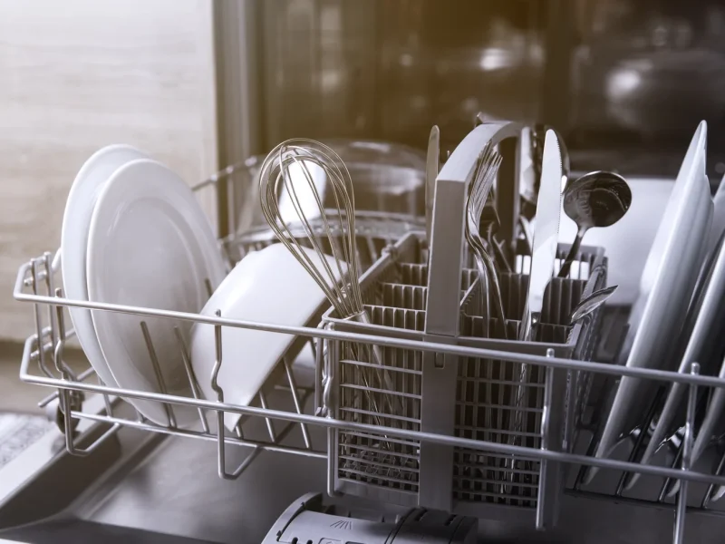 open-dishwasher-with-clean-utensil-inside-cutlery-2023-11-27-05-20-51-utc